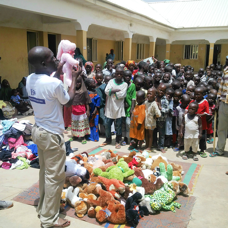 Children rescued from Boko Haram lined up to receive toys site