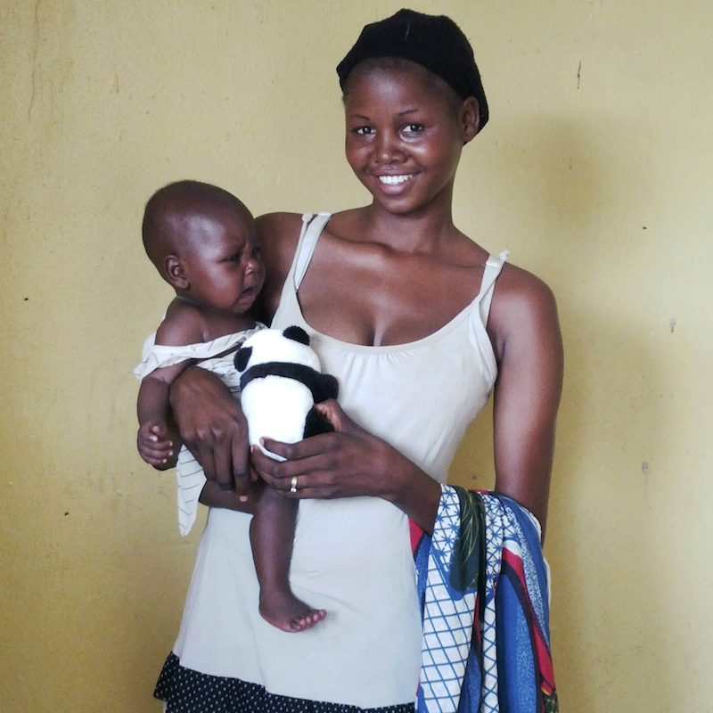 rescued woman and baby with toy site